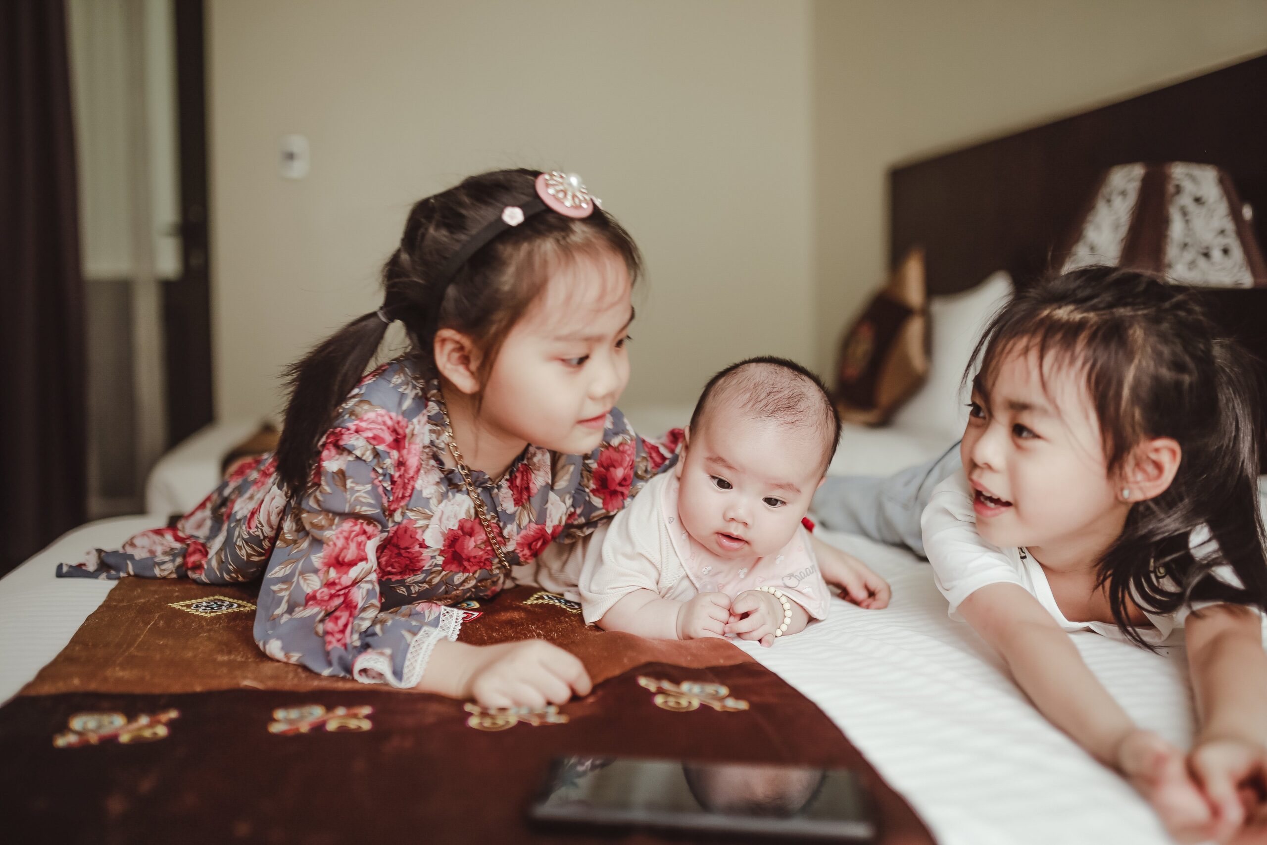 three siblings,Sibling Jealousy: 3 Ways to Help Older Siblings Connect with the New Baby