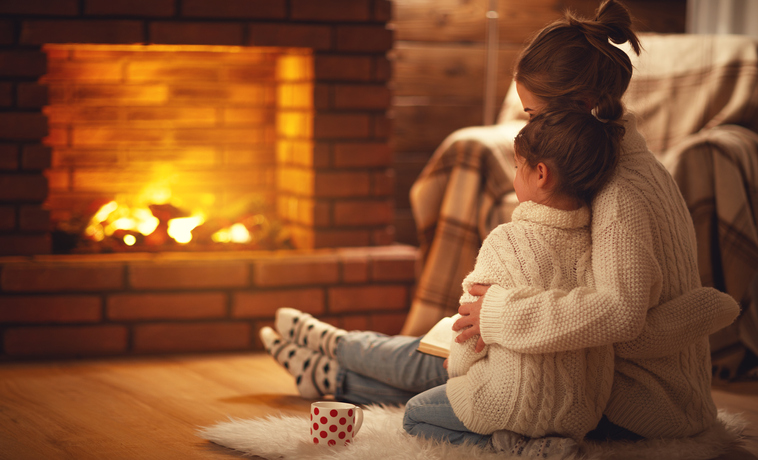 family mother and child hugs and warm on winter evening by fireplace, Why Screen Time Battles Happen And What Really Drives Your Child’s Habits, Peace at Home, Parenting solutions, help for parents, Screen Time Tips