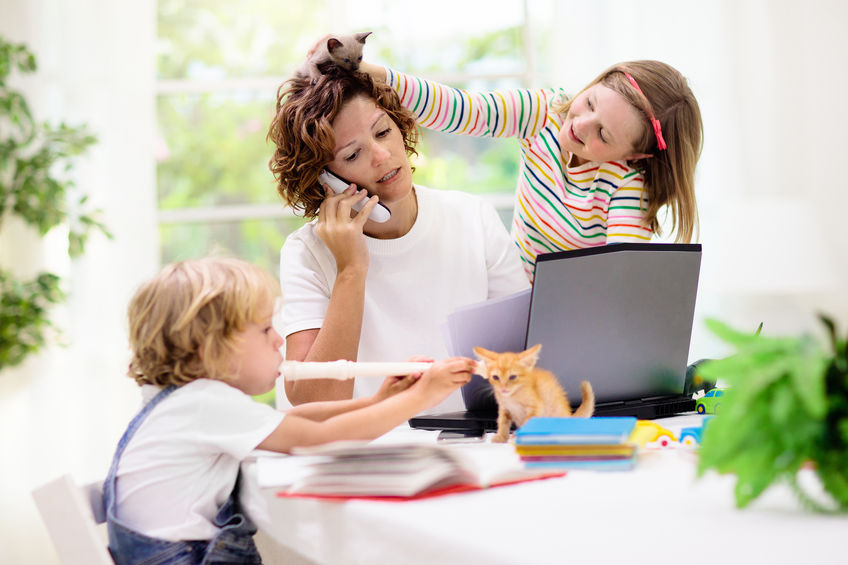 Mother working from home with kids.