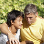 Father and son hugging