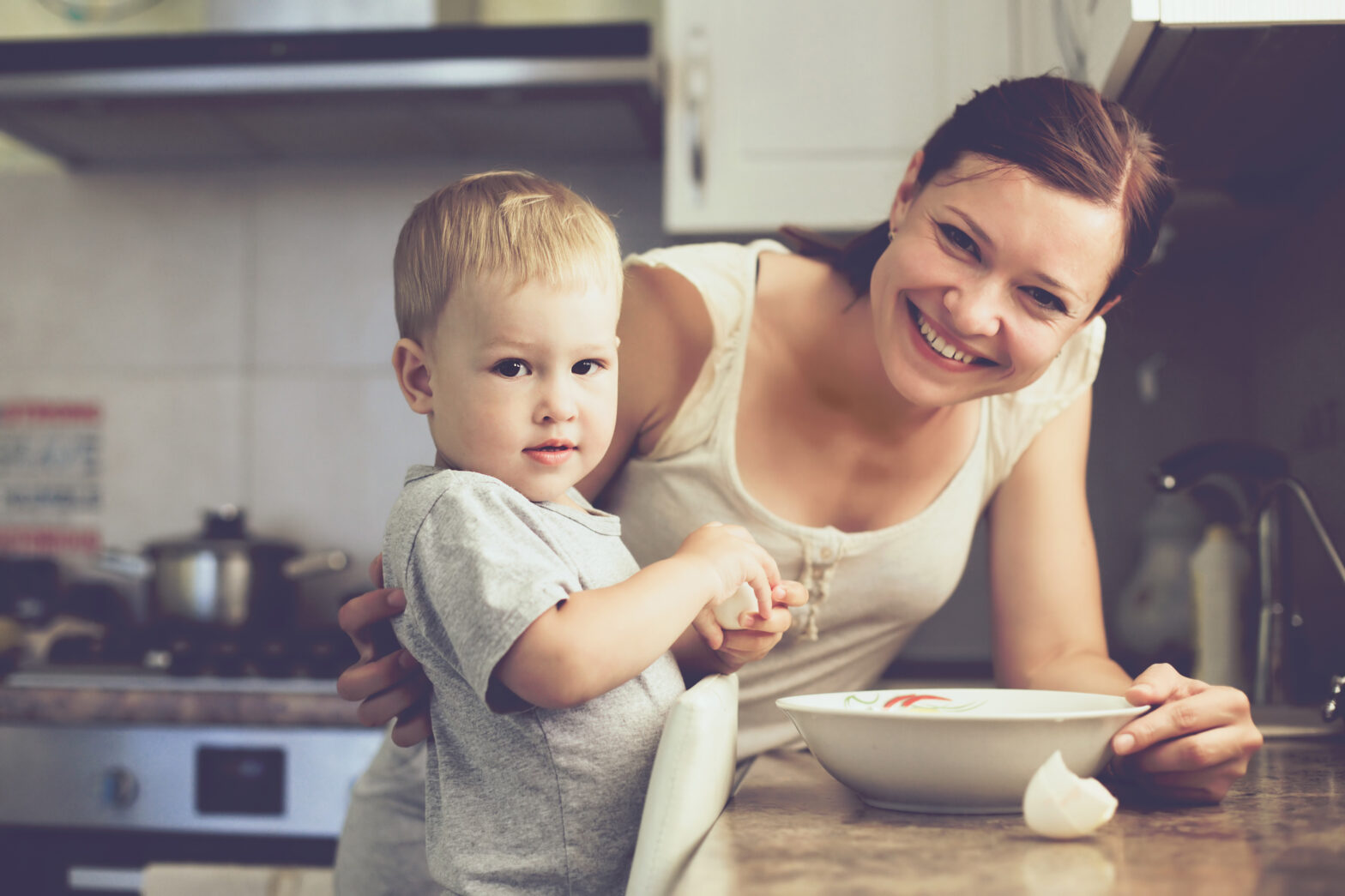 Mother with child cooking together