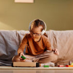Girl with Down Syndrome Playing, Navigating Neurodiversity: Understand Sensory Disorders and Support Neurodiverse Children