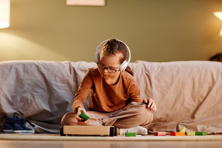 Girl with Down Syndrome Playing, Navigating Neurodiversity: Understand Sensory Disorders and Support Neurodiverse Children