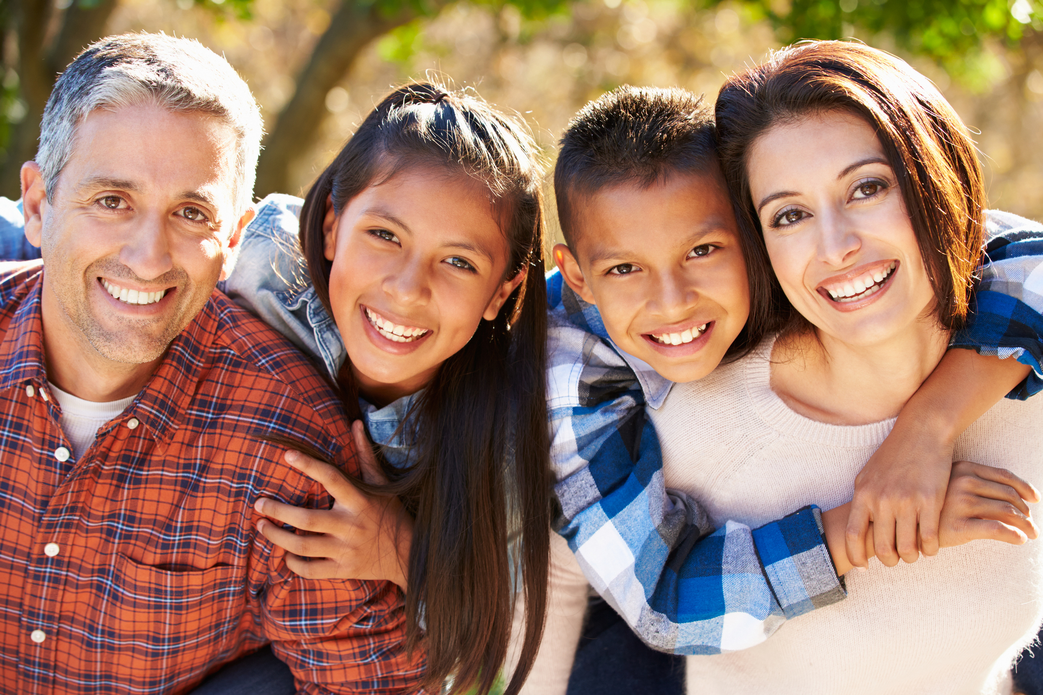 Portrait Of Hispanic Family In Countryside Smiling To Camera Parenting Basics: Daily Routines & Healthy Habits (All Ages)