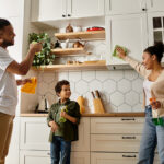 Together, a loving family cleans the kitchen and enjoys quality time at home, Lighten the Mental Load: Create a Meaningful Low-Stress Holiday Season